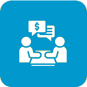 Two people discussing financial matters at a table.